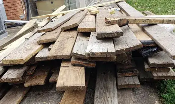construction lumber stacked by the house