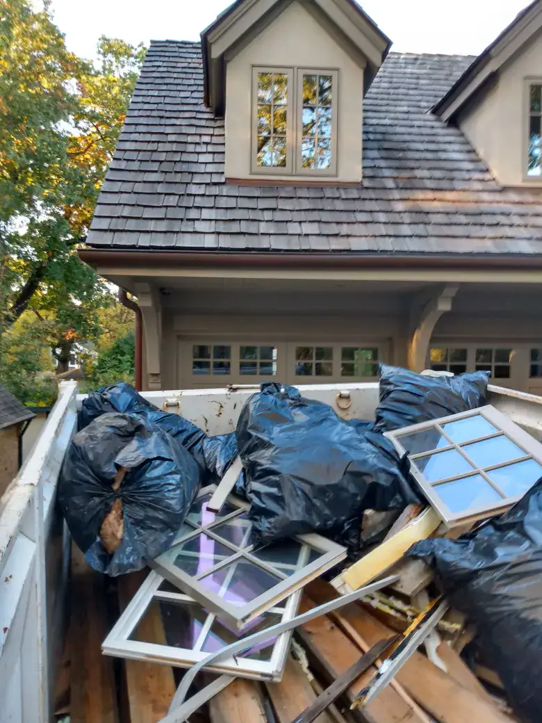 orange crew truck full of construction debris
